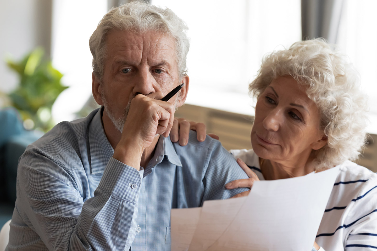Picture of a wife and husband reviewing documents.
