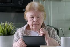 Image of an older woman looking at her IPad