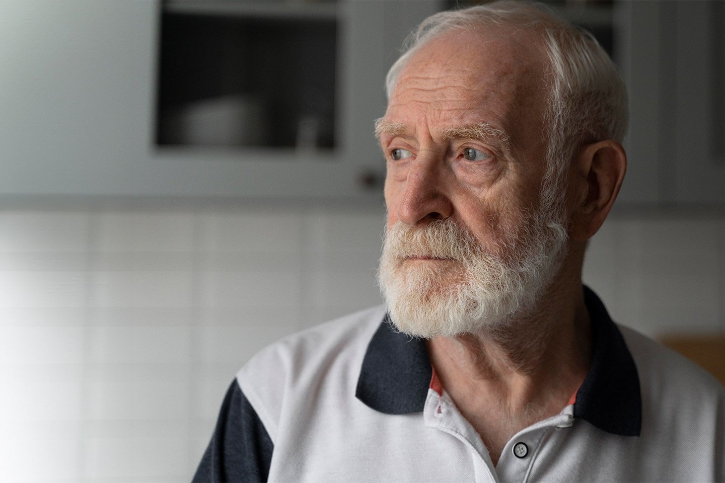 Photo of bearded man wearing a polo shirt