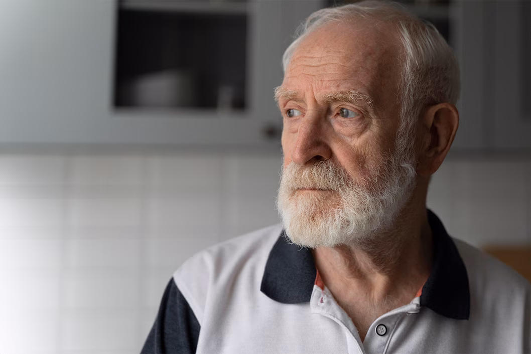 Photo of bearded man wearing a polo shirt