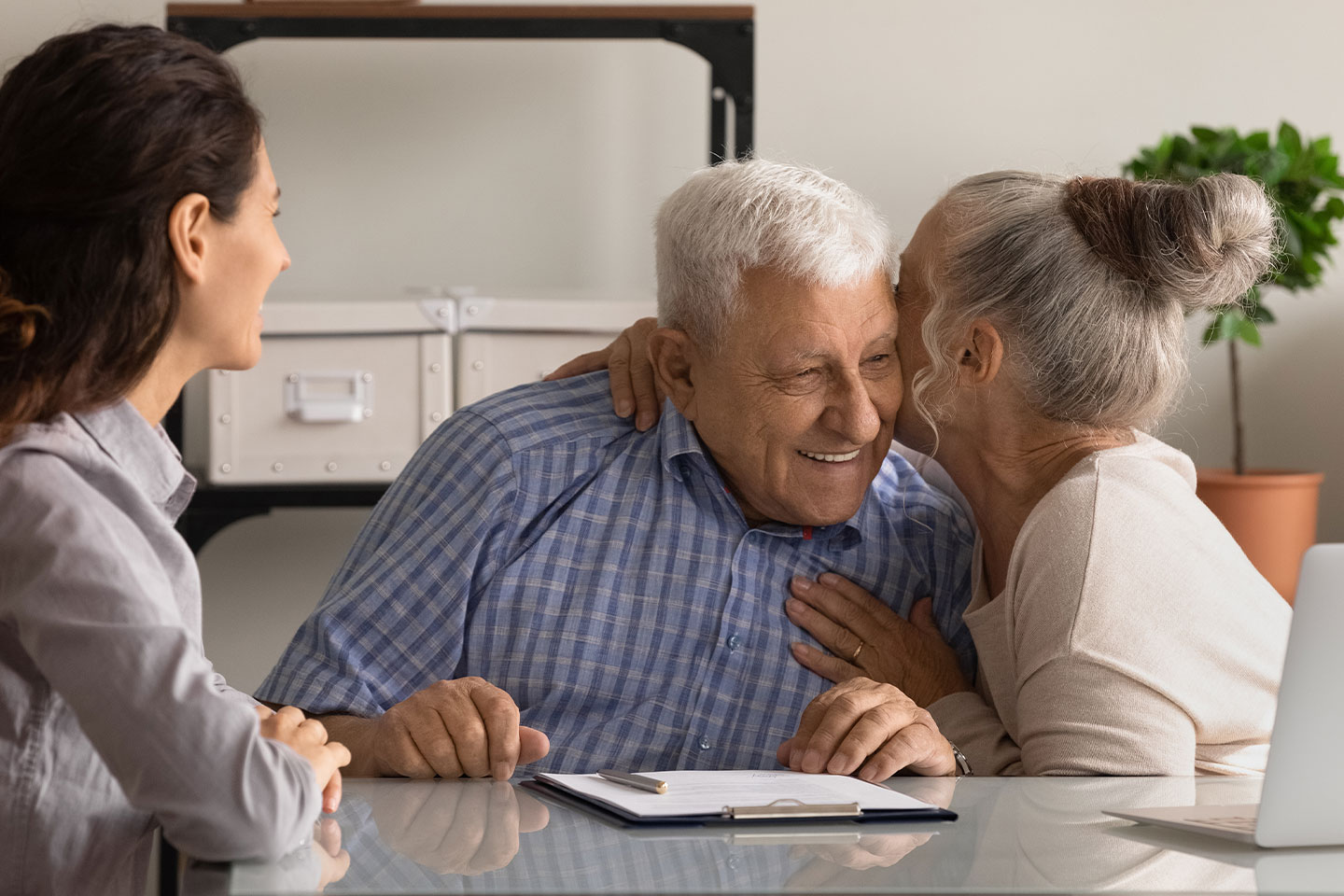 Photo of woman hugging man at a table