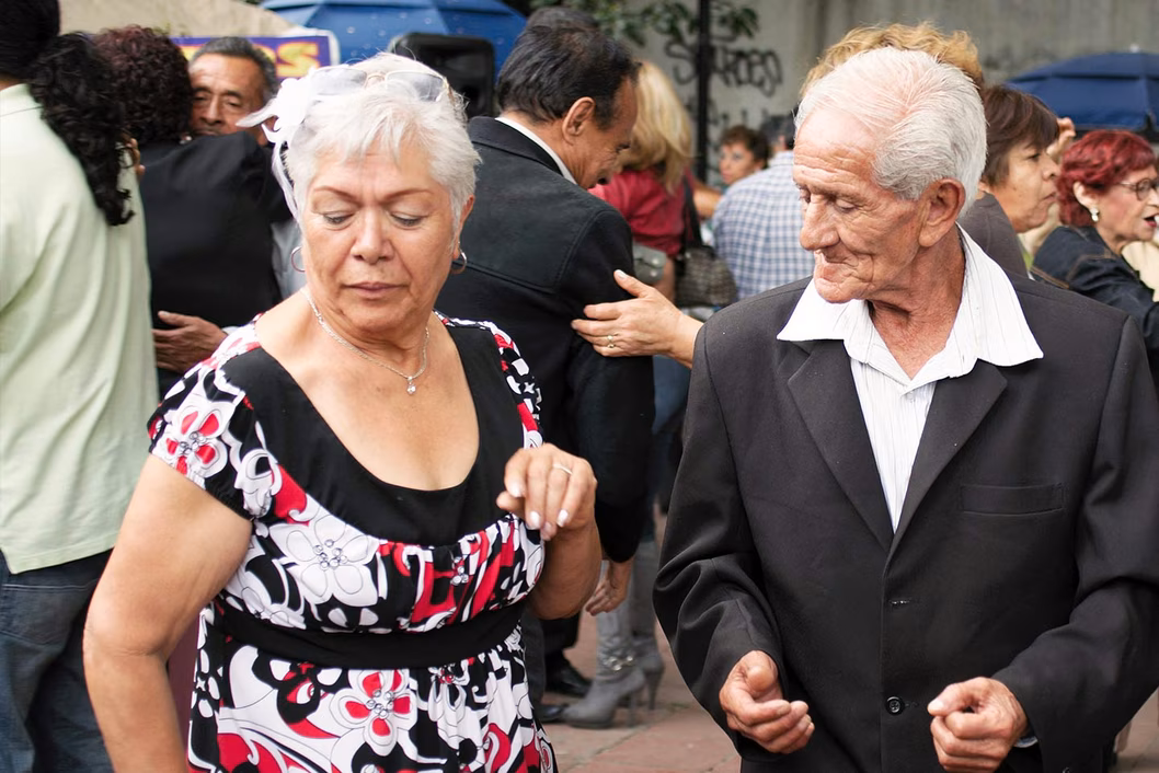 Photo of two seniors taking their dancing seriously