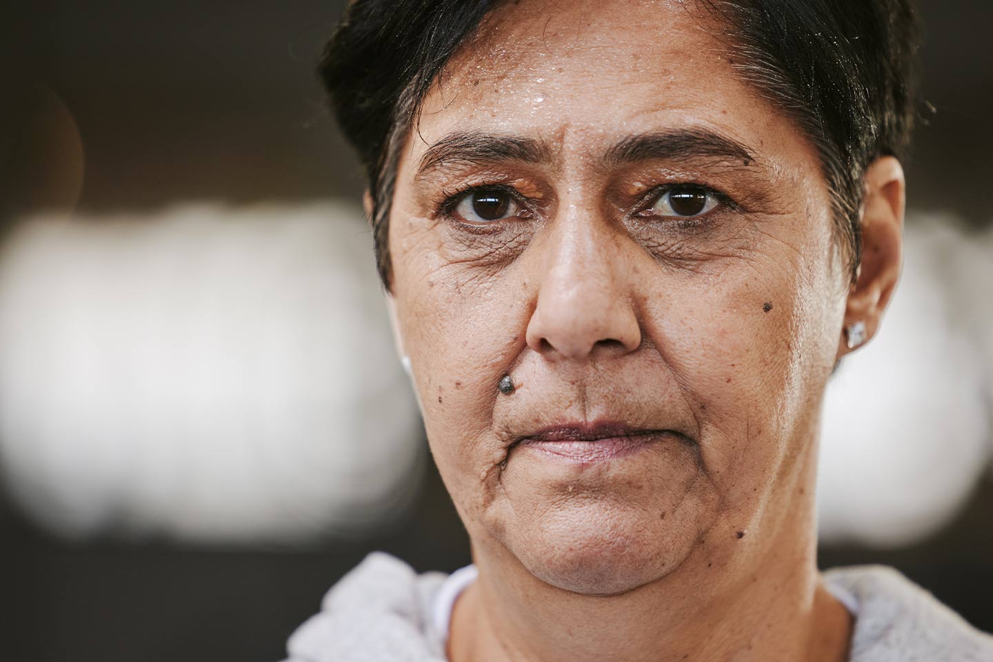 Photo of woman with pursed lips and piercing look