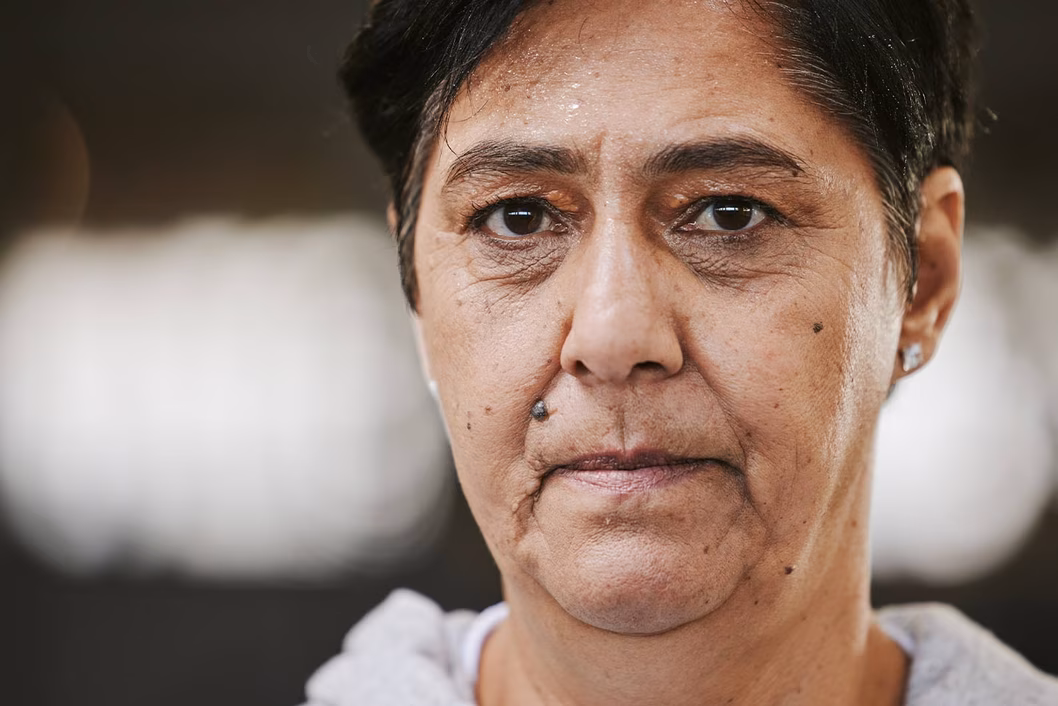 Photo of woman with pursed lips and piercing look