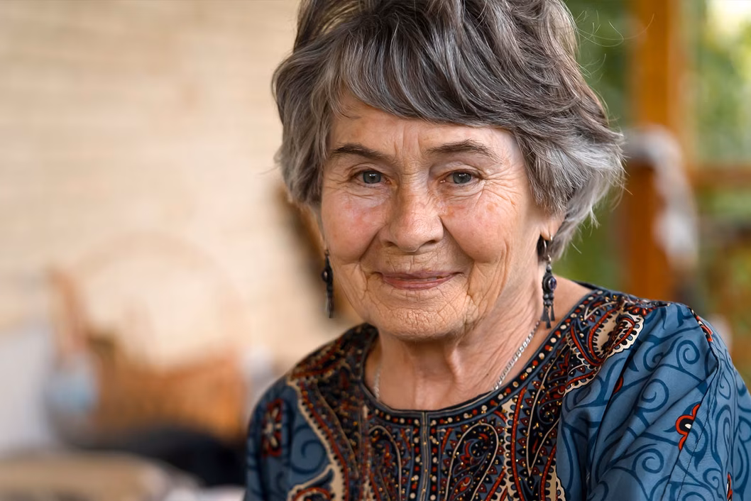 Image of an older woman with short grey hair