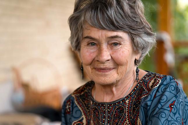 Image of an older woman with short grey hair