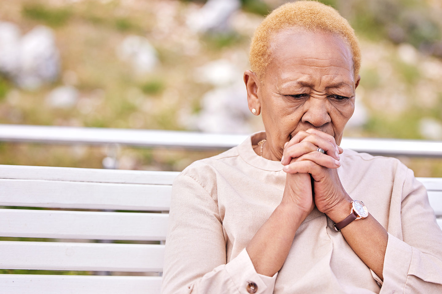 Photo of a woman sitting on a park bench