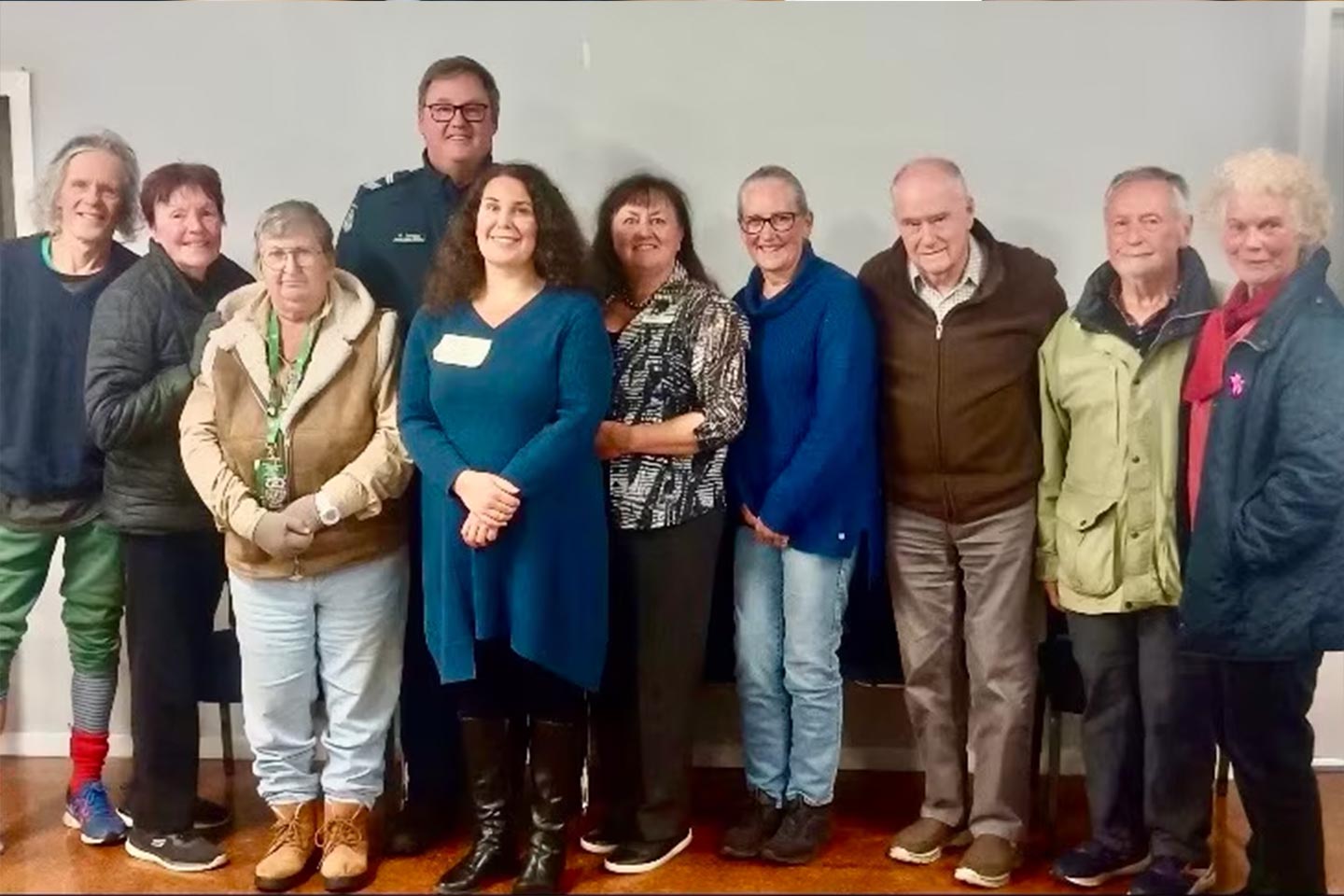 Photo of a group of people smiling at the camera