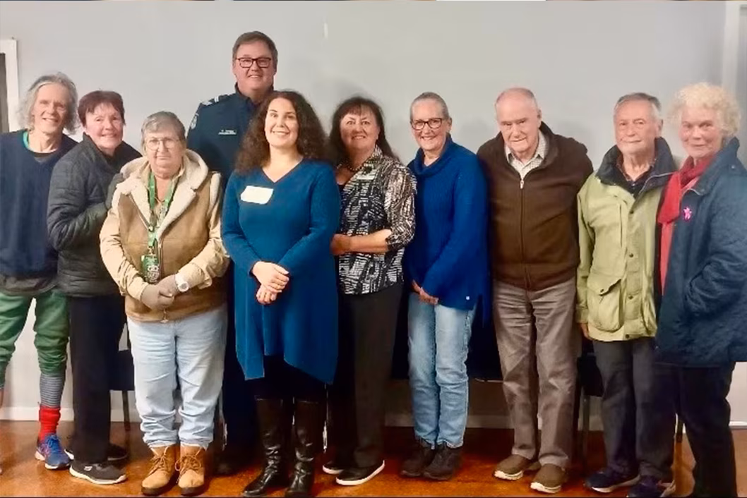 Photo of a group of people smiling at the camera