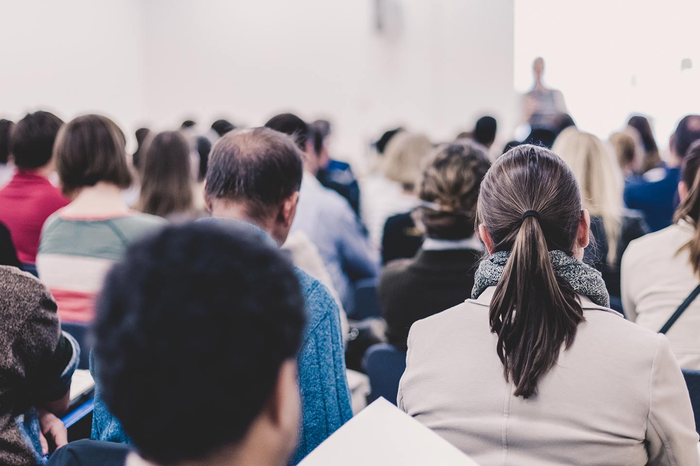 Photo of a group of people at a speaking event