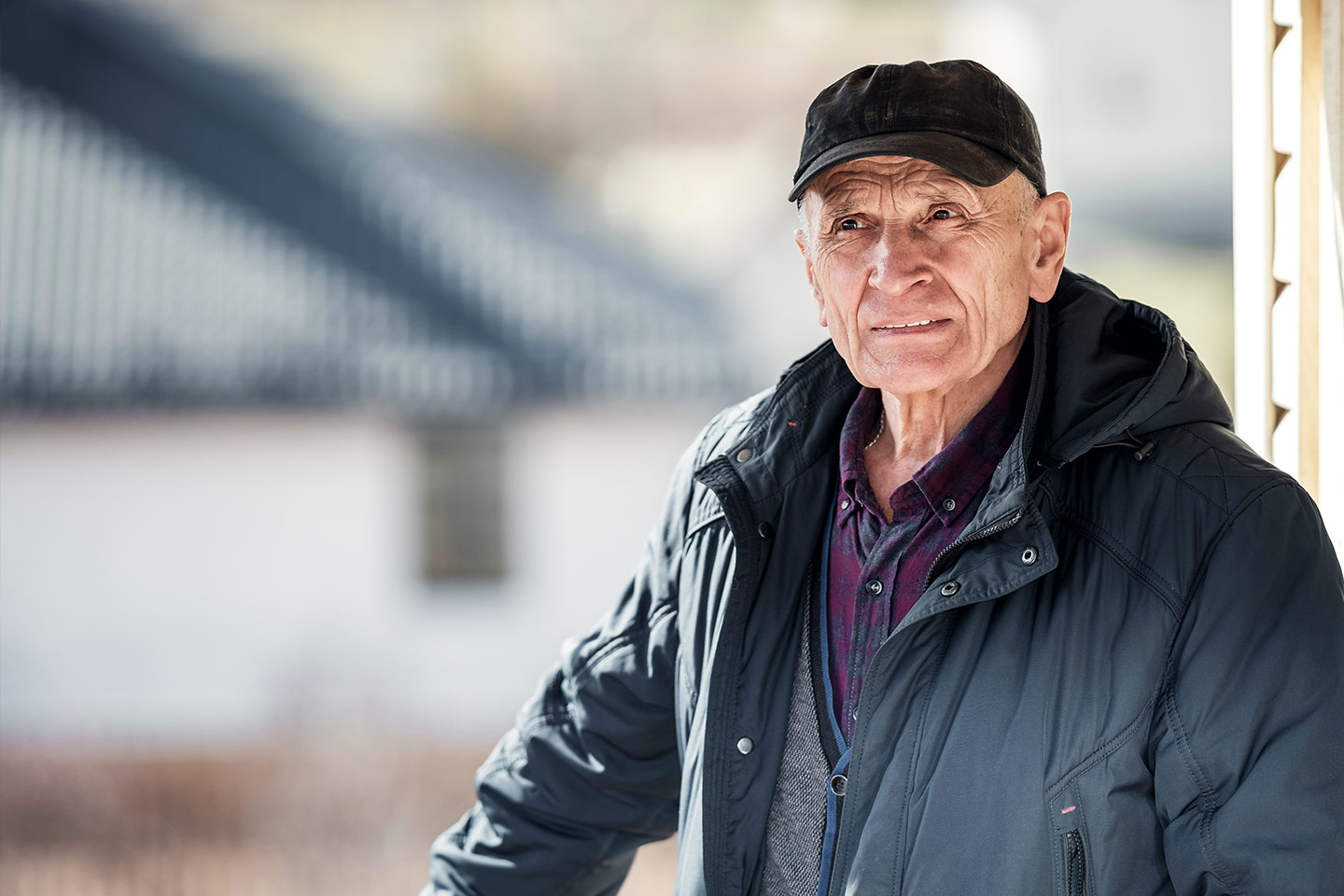 Photo of a person in a black puffer jacket and cap