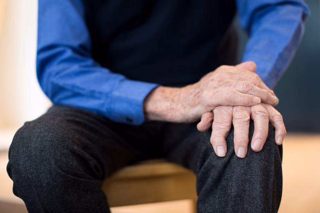 Senior man sitting down