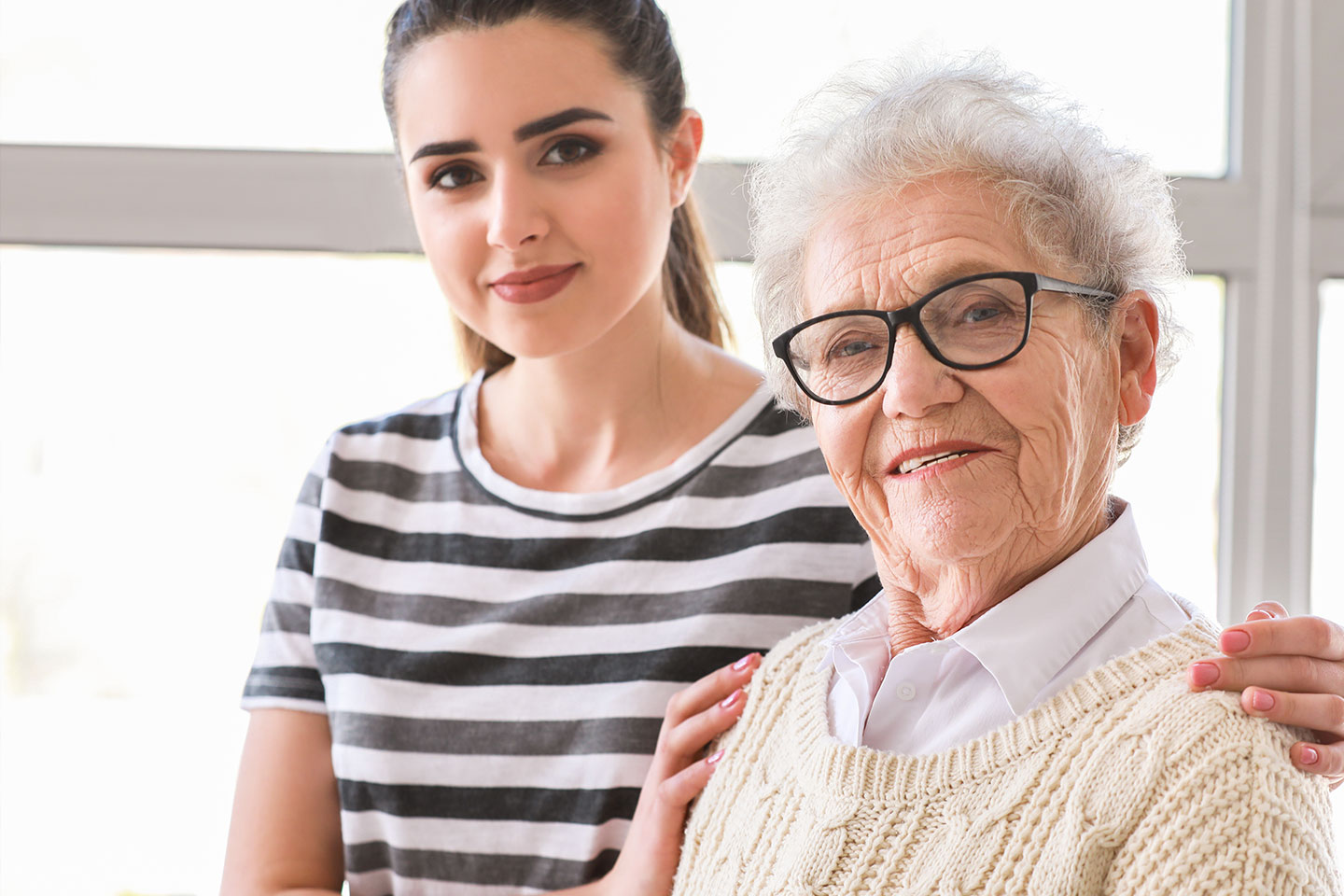 Photo of a young woman and an elderly woman