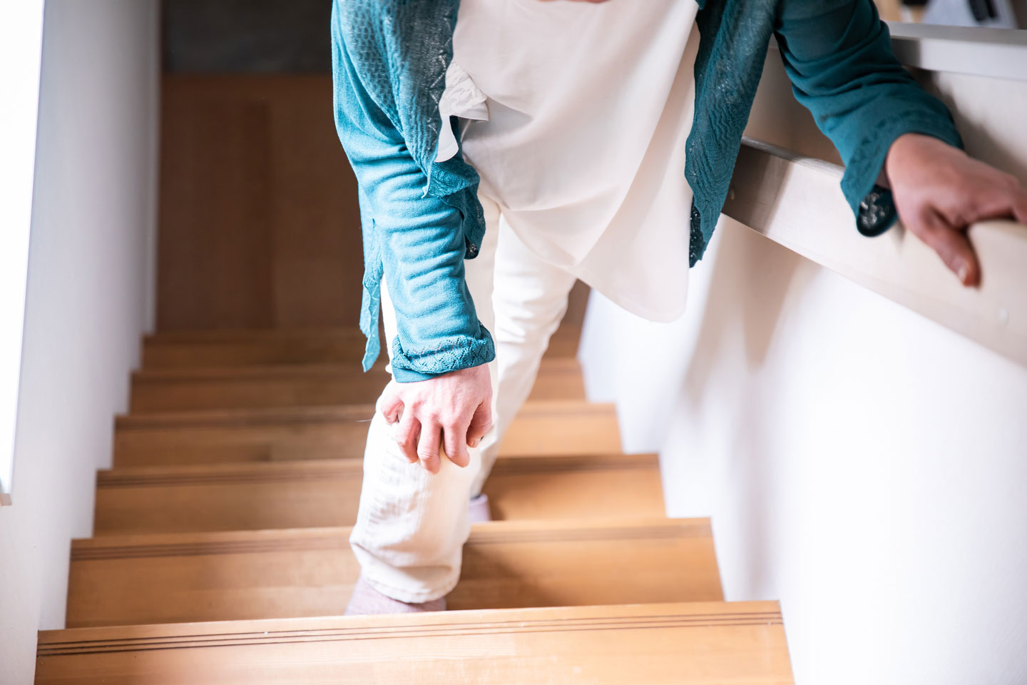 Senior woman walking up stairs