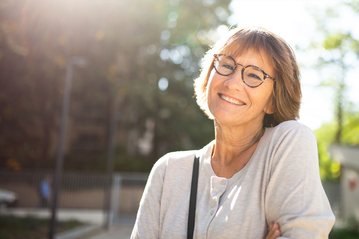 Photo of woman smiling in the sunshine