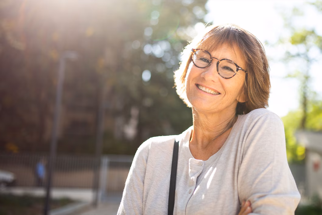 Photo of woman smiling in the sunshine