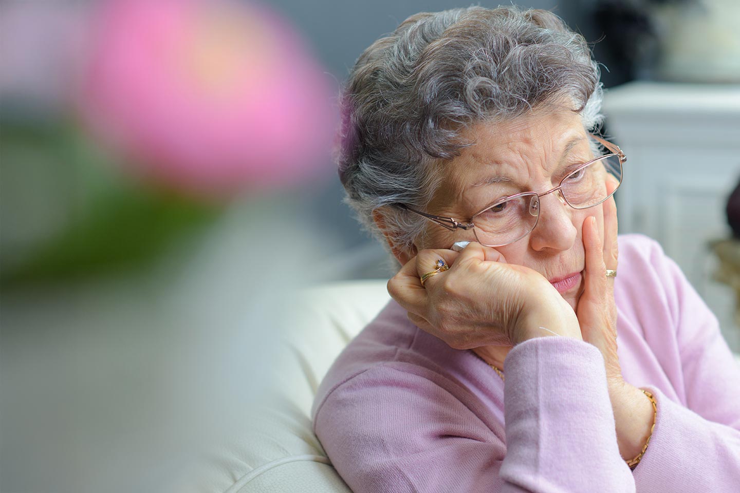 Photo of a woman wearing a lilac jumper