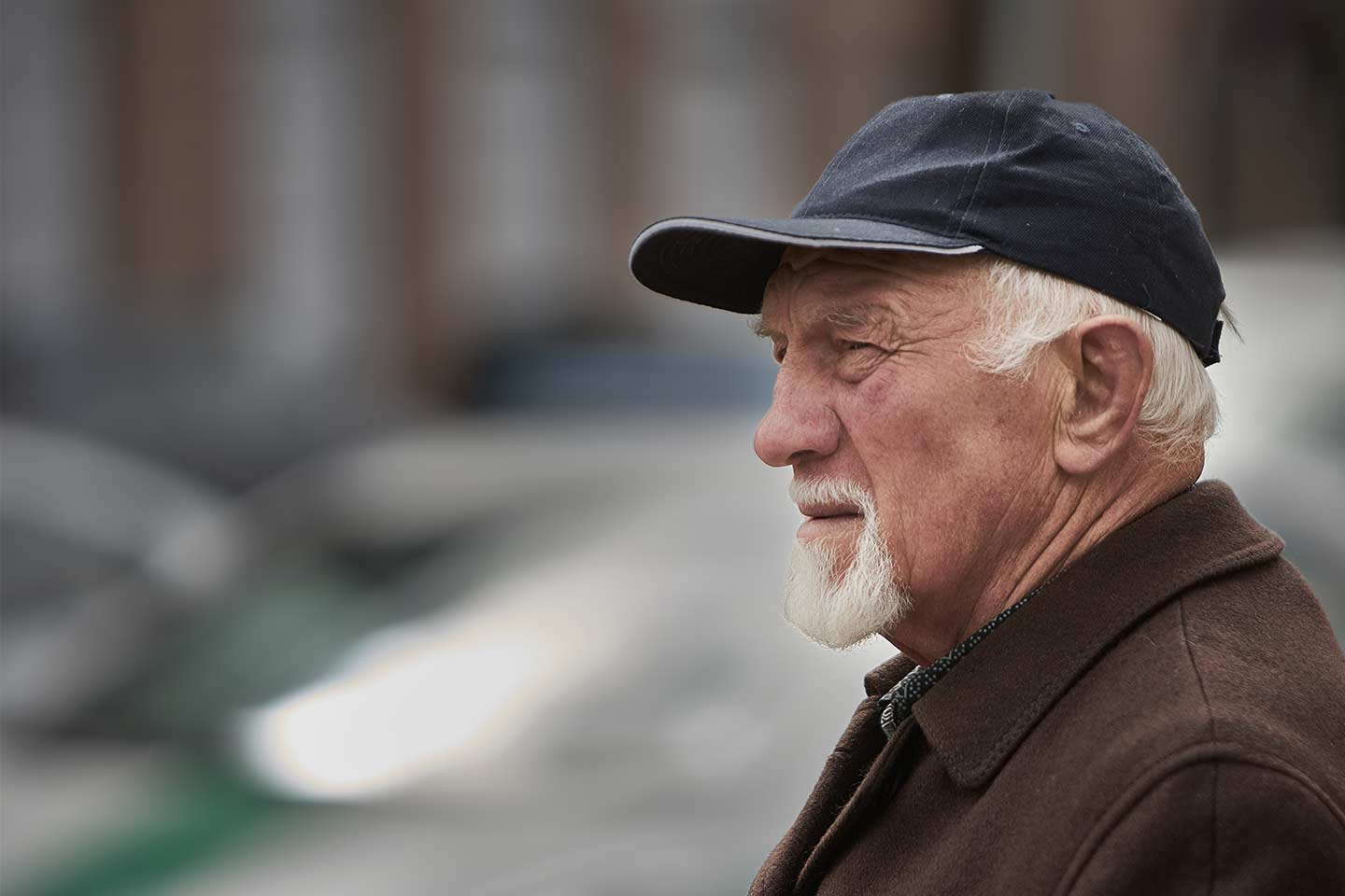 Photo of bearded man wearing a cap