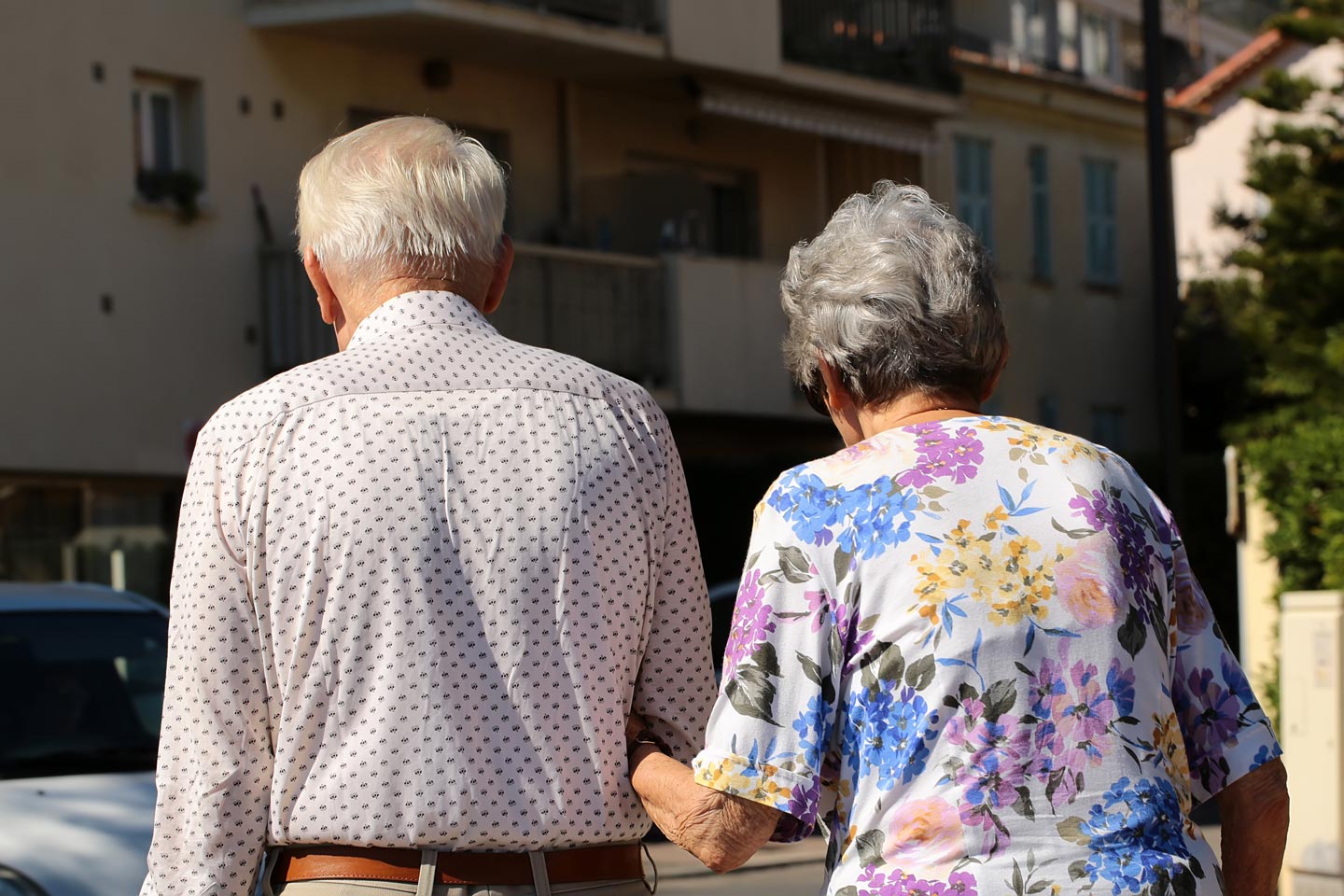Senior couple walking down the street