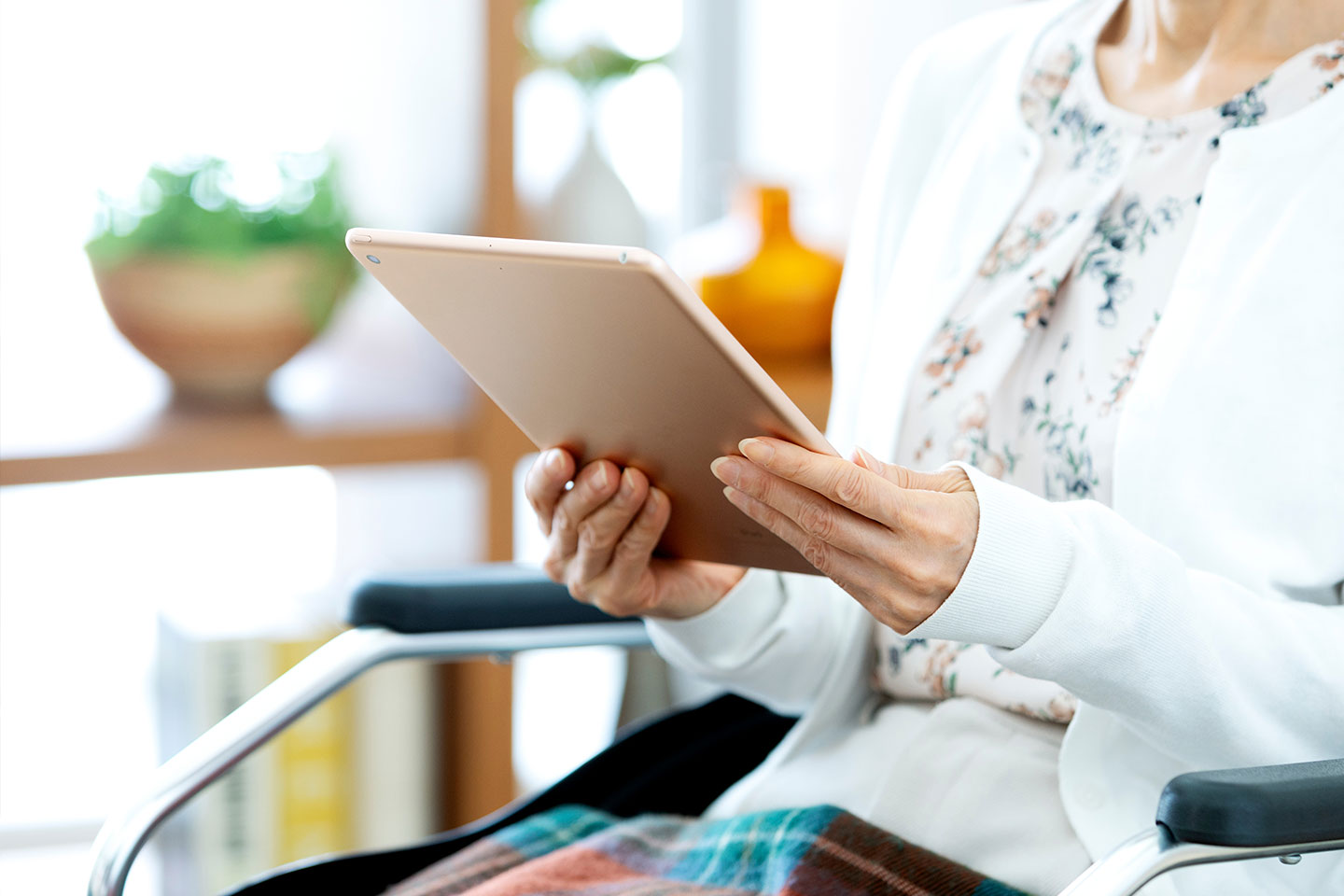 Photo of woman holding a computer tablet
