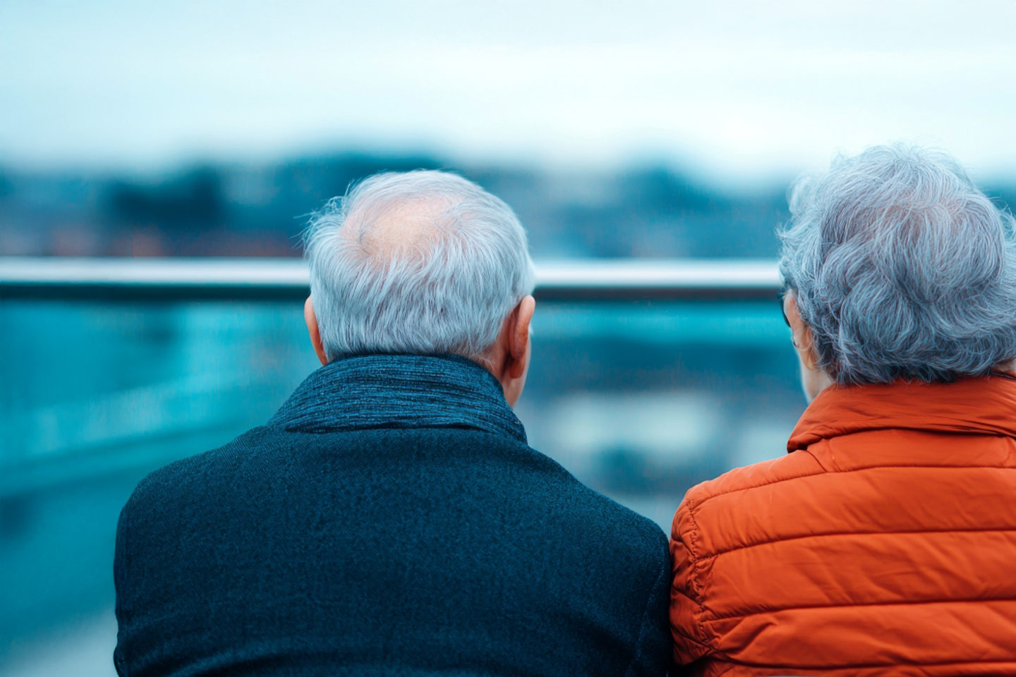 Photo of two people wearing warm jackets