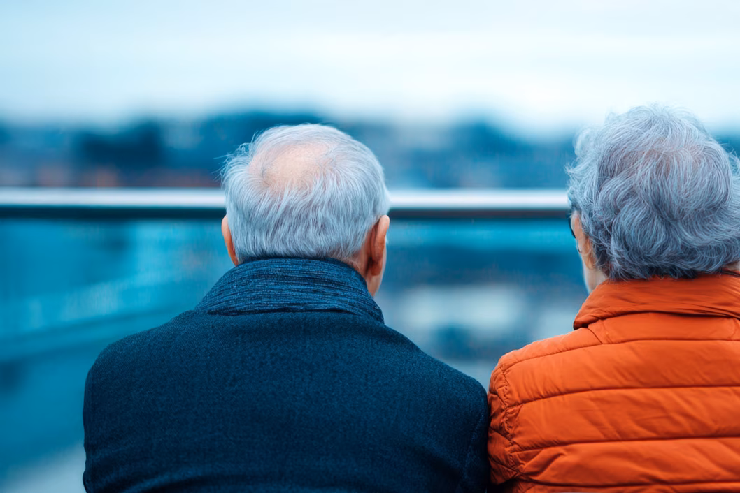 Photo of two people wearing warm jackets