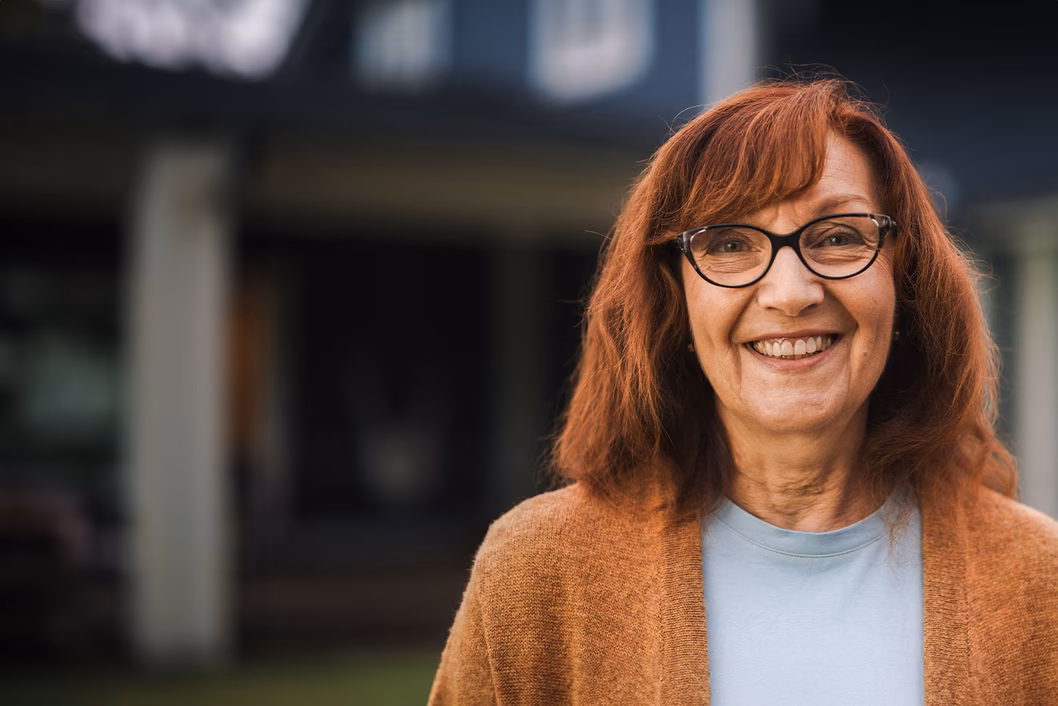 Image of an older woman with copper coloured hair