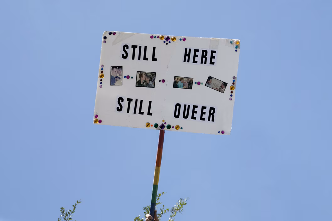 Still here, still queer sign 