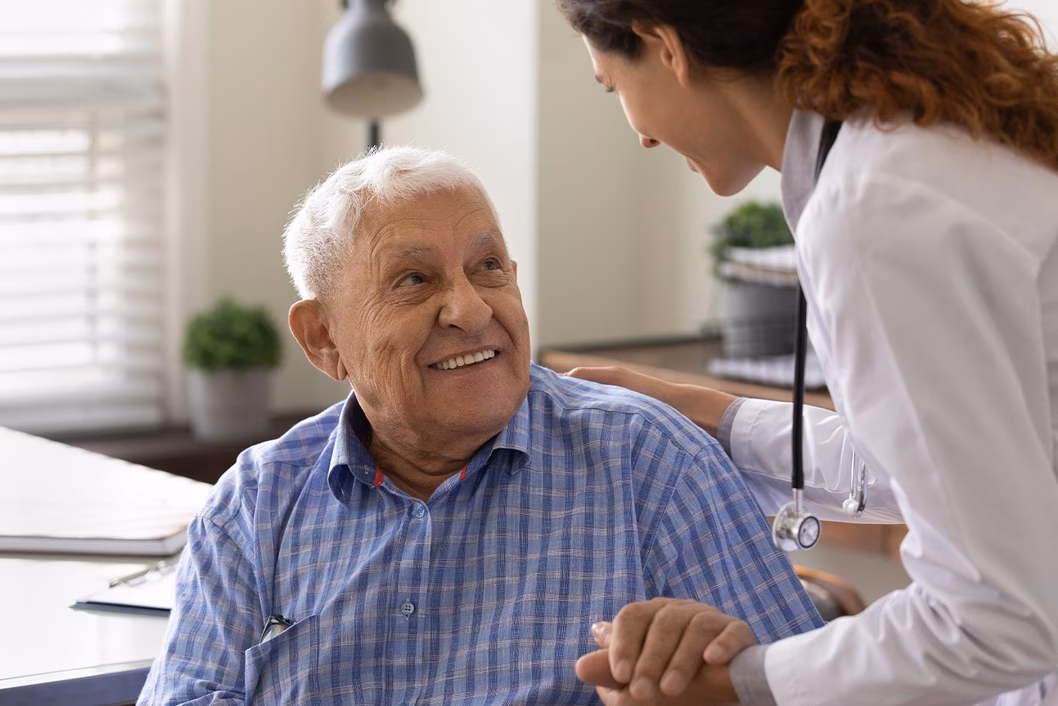 Photo of senior patient with doctor in a white coat