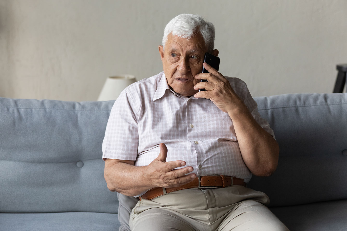 Photo of man using a mobile telephone