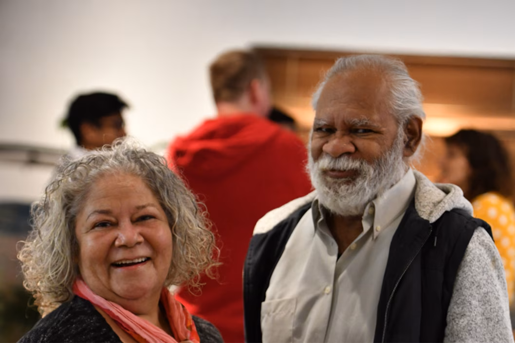 Photo of a smiling couple at a gathering