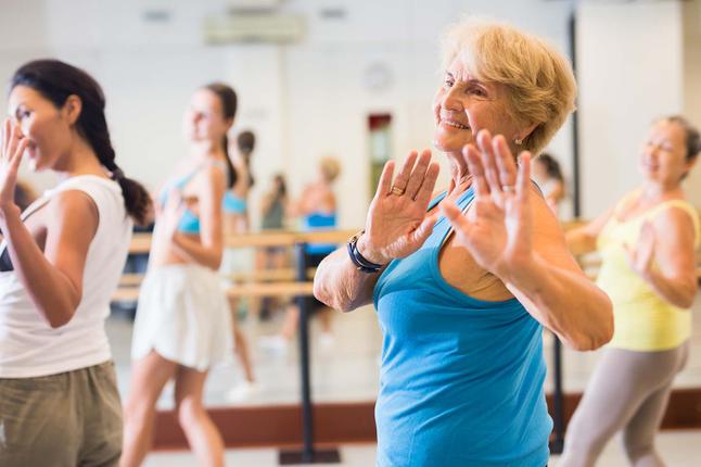 Photo of women in a dance class wearing gym clothes