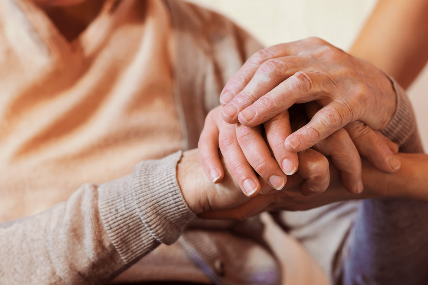 Photo of clasped hands in closeup