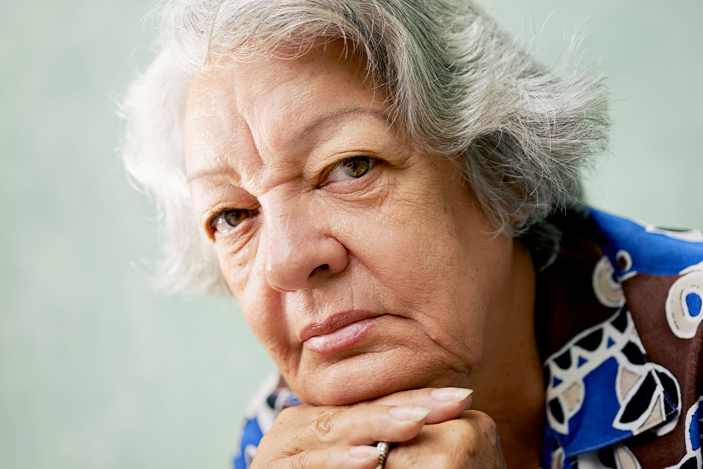 Photo of woman resting her chin on her hands