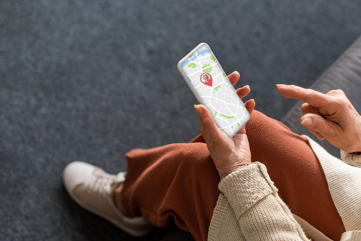 Image of an older woman looking at her tracking on her smartphone