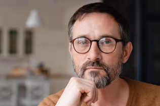 Image of an older man wearing glasses