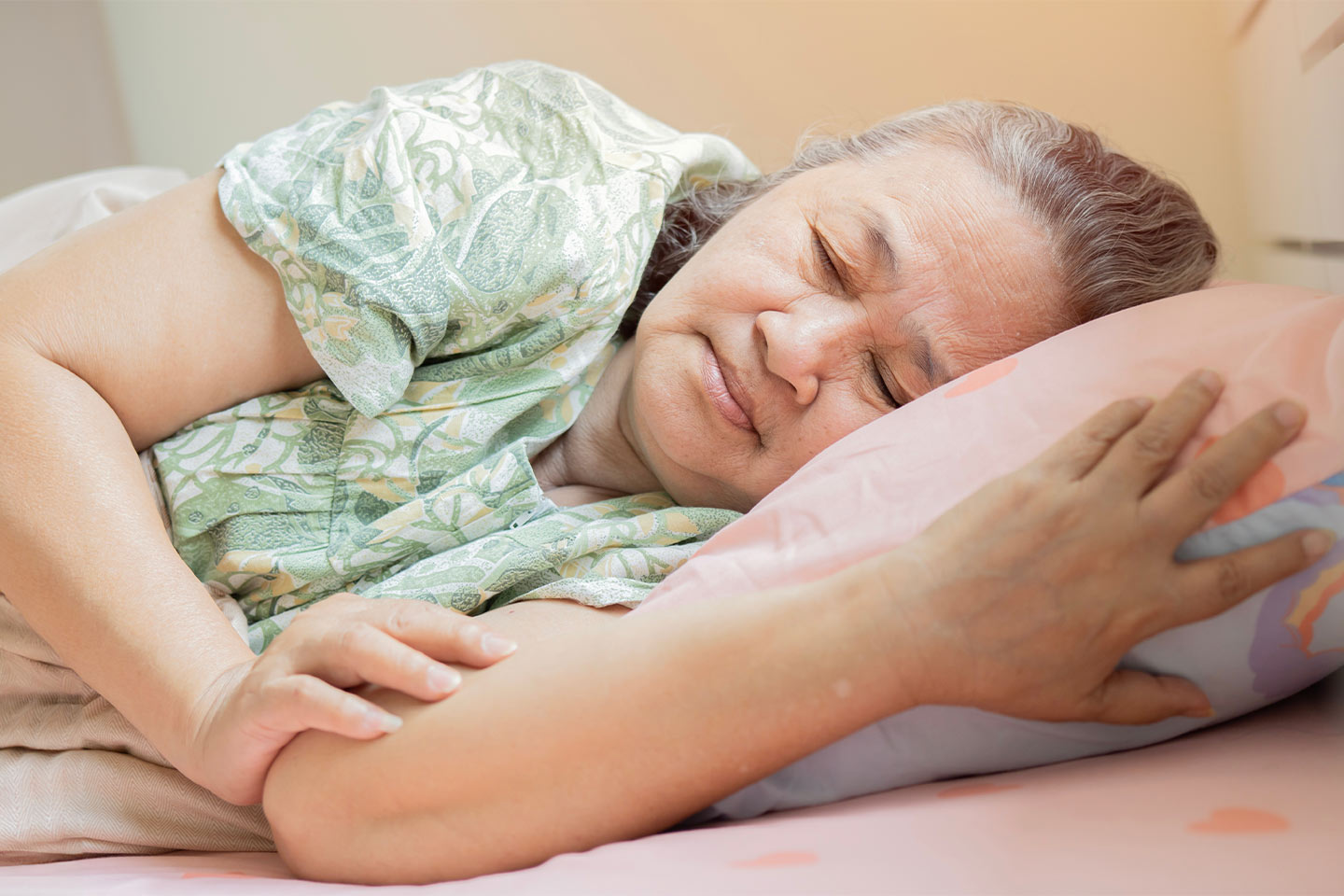 Image of an older Asian woman sleeping