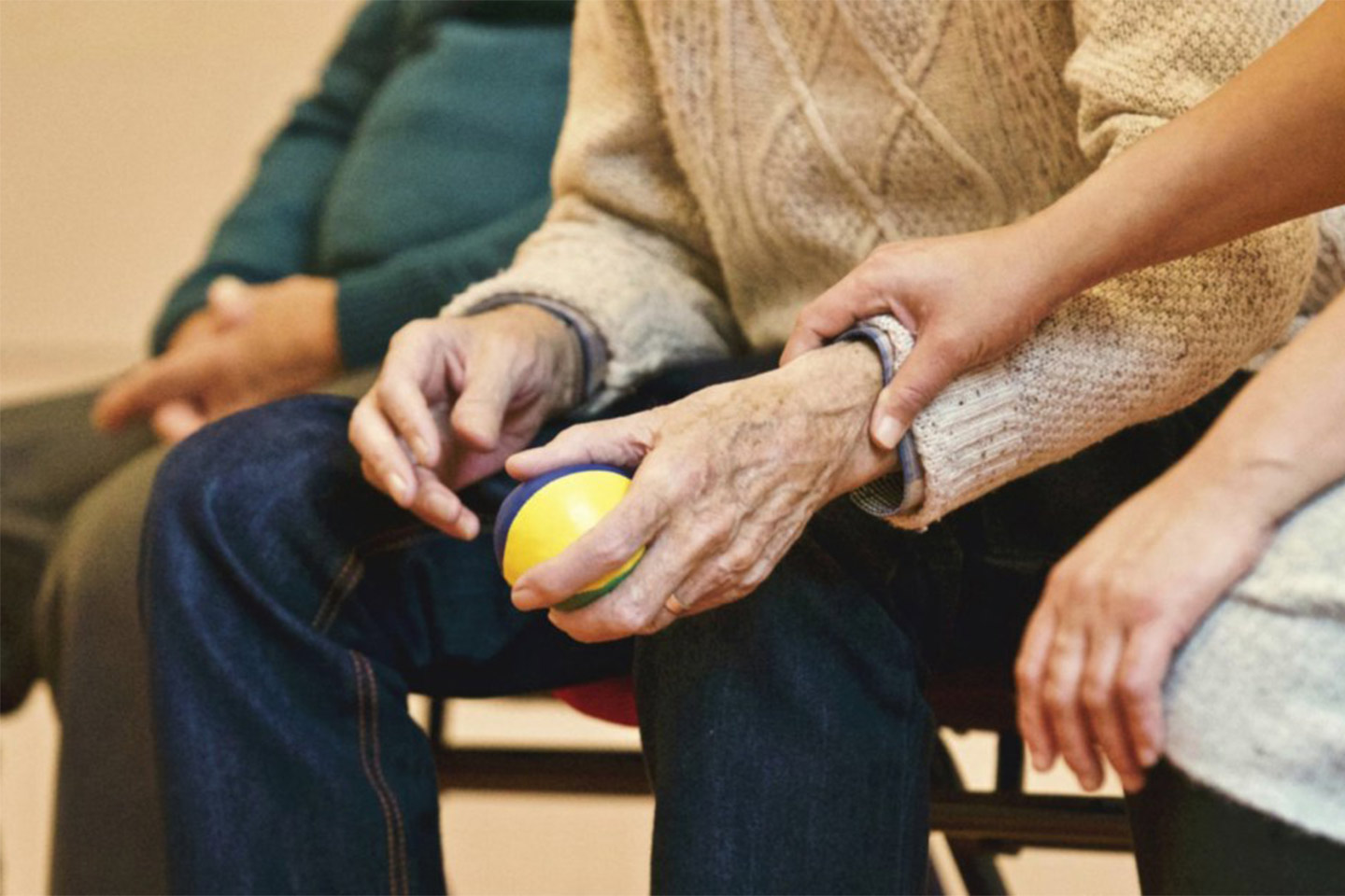 Photo of a hold and young hands and laps