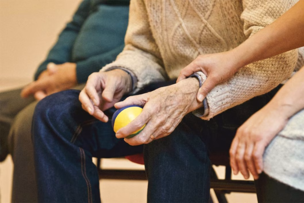 Photo of a hold and young hands and laps