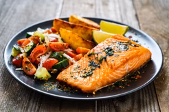 Plate of salmon, potatoes and salad