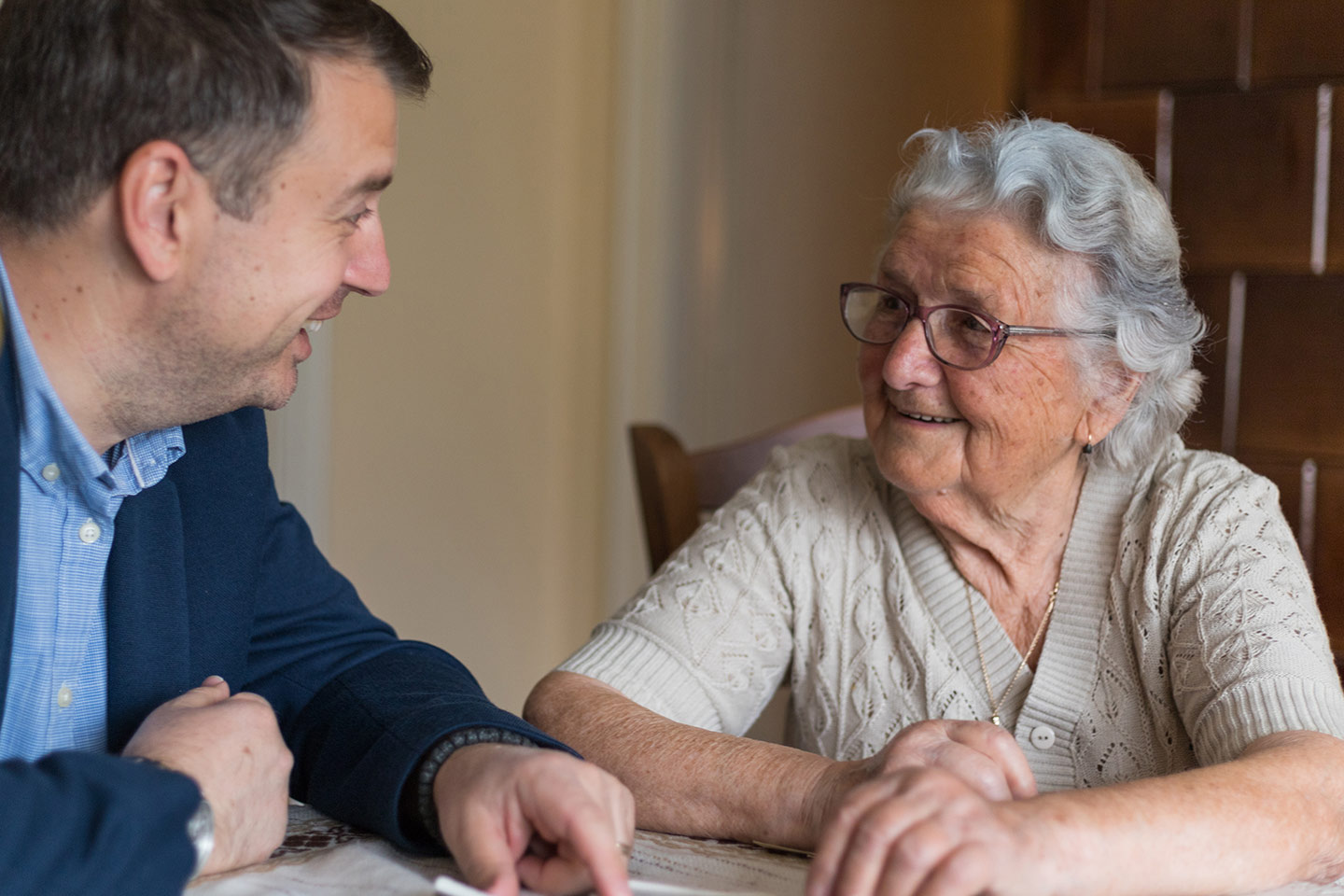 Photo of a man and a woman smiling at each other
