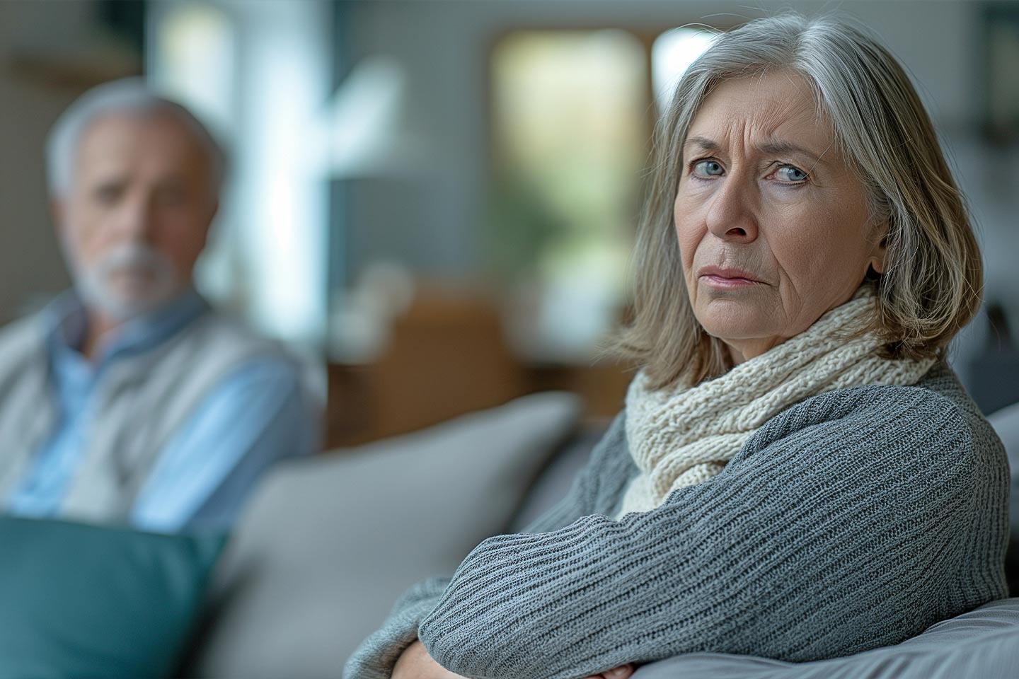Photo of woman with a grey jumper looking stressed