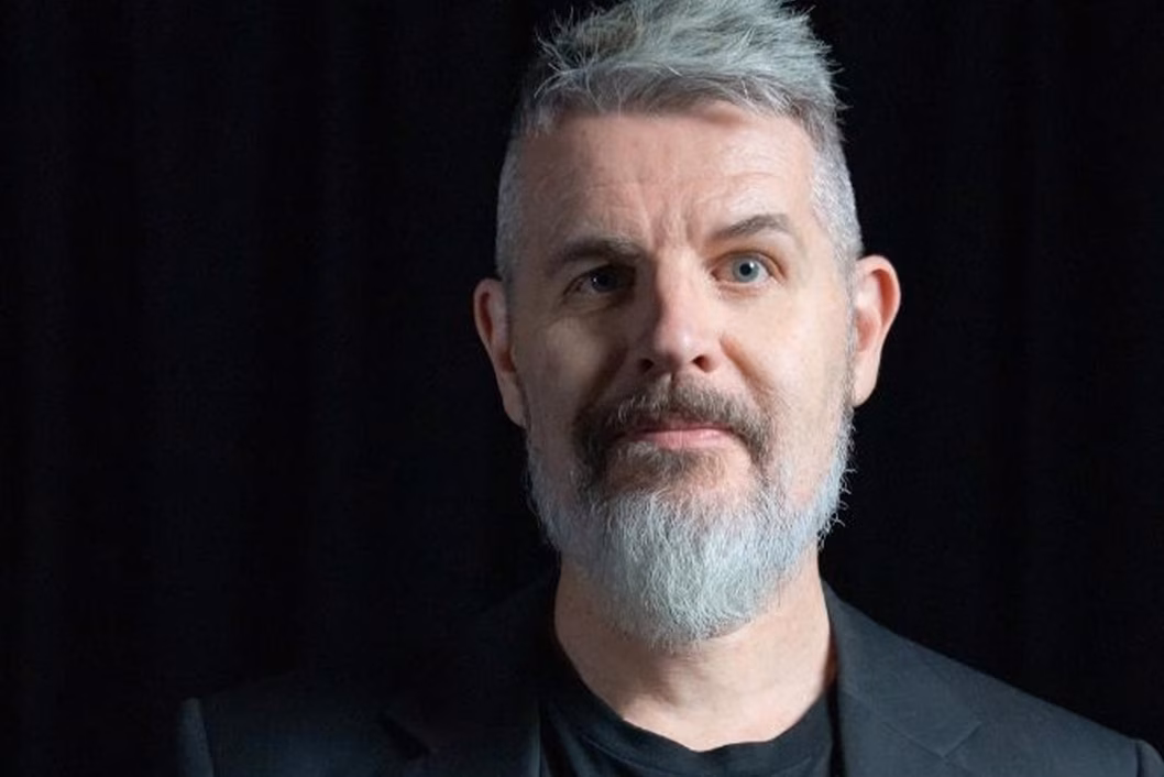 Photo of man with grey beard and hair