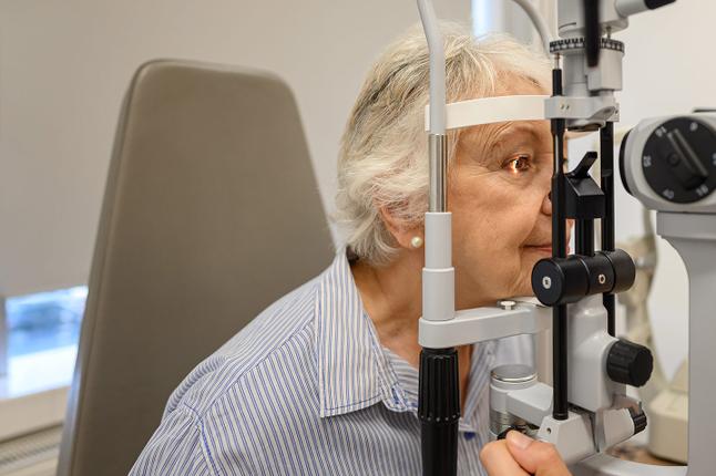 Photo of a woman having her eyes tested at the optometrist