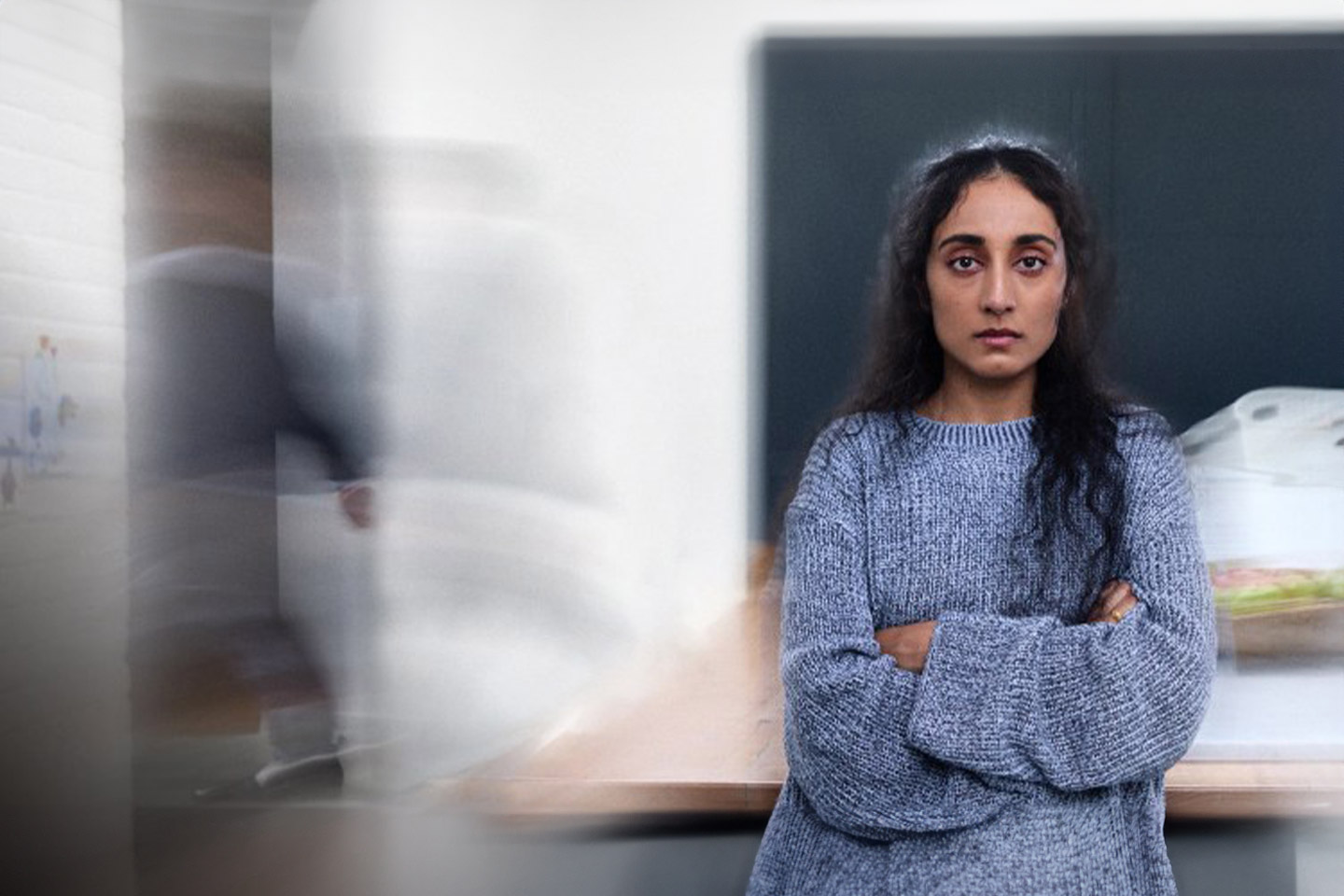 Photo of woman looking serious with arms crossed