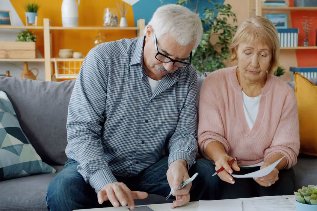 Photo of a man and a woman going through paperwork together