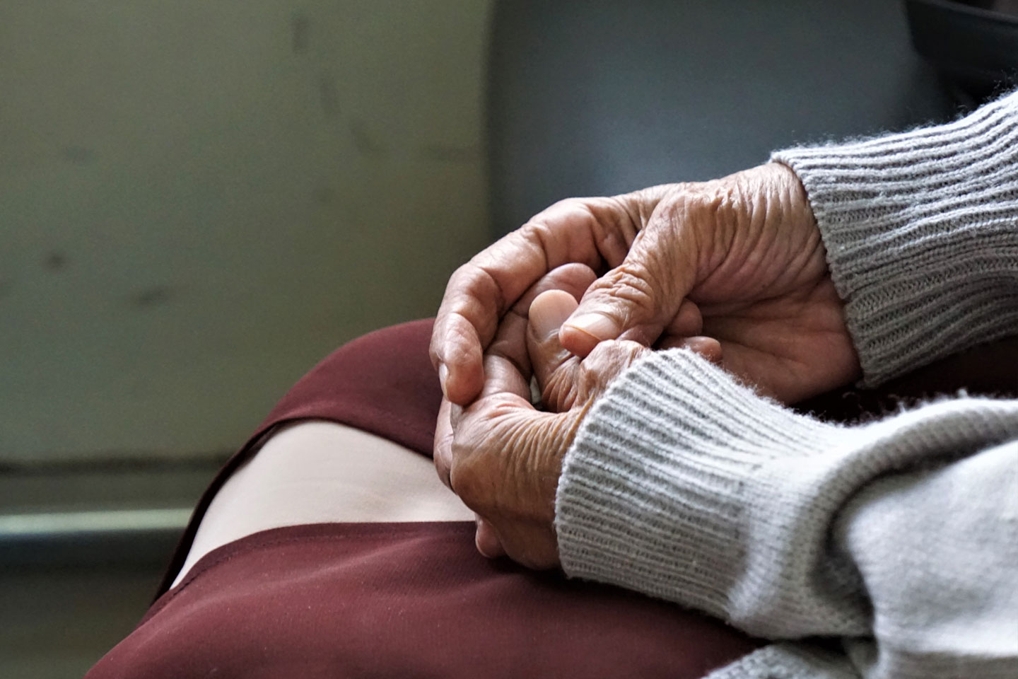 Senior woman's hands in lap