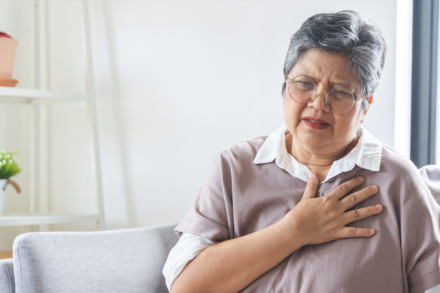 Photo of a woman in glasses looking troubled