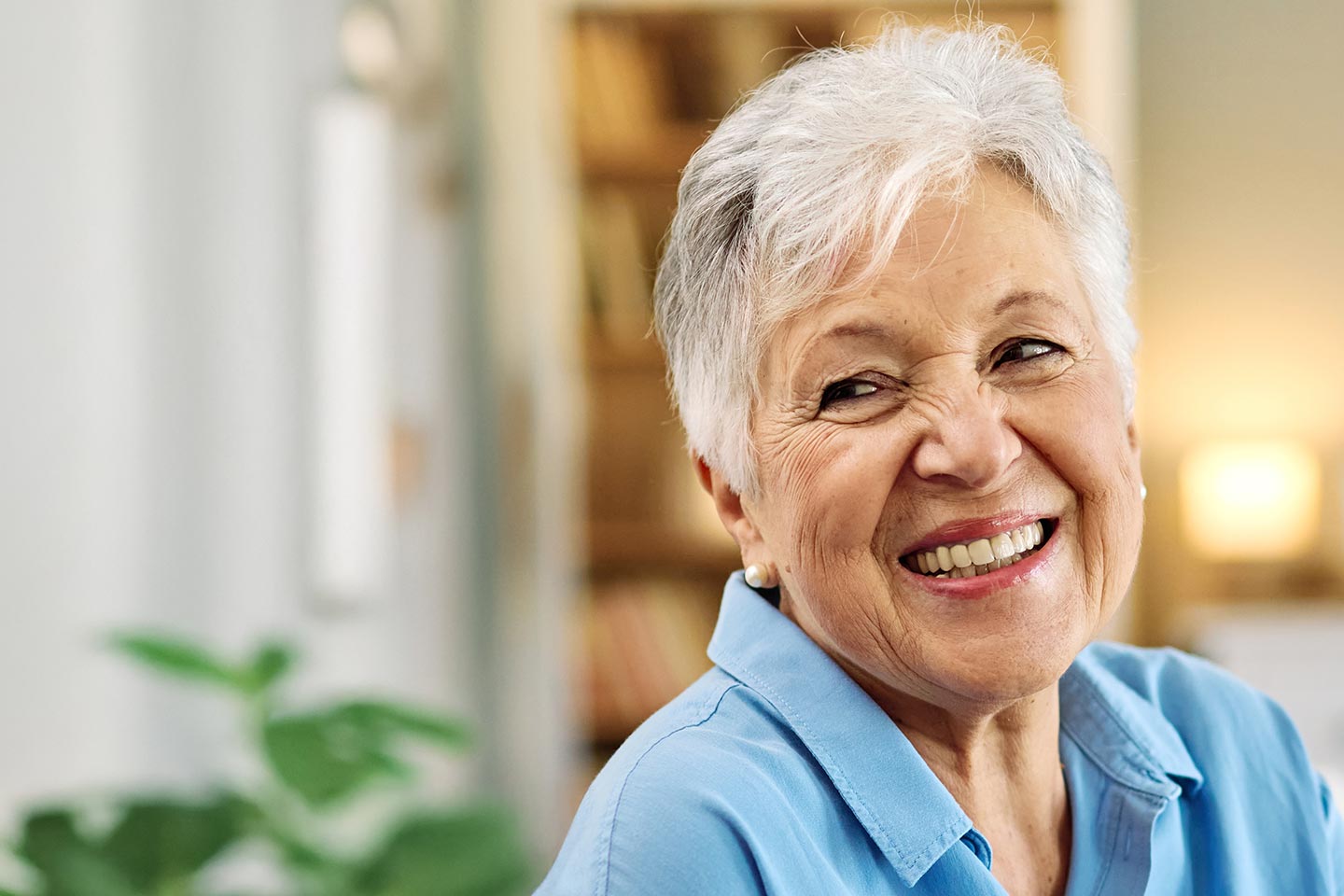 Photo of a happy woman in a blue blouse