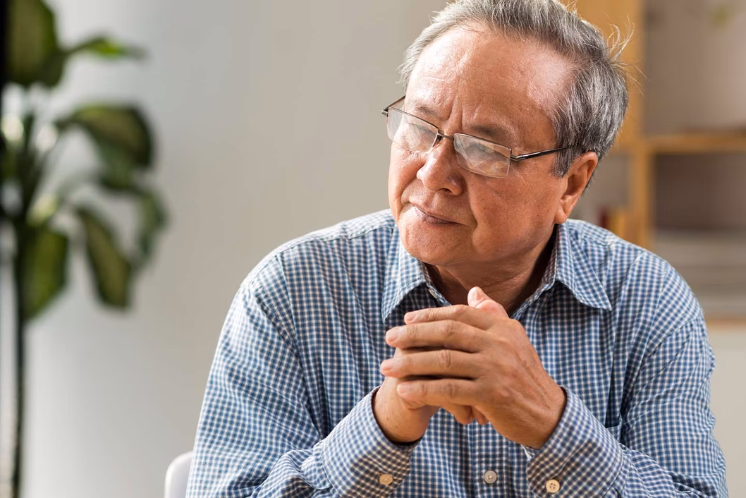 Photo of senior man looking pensive